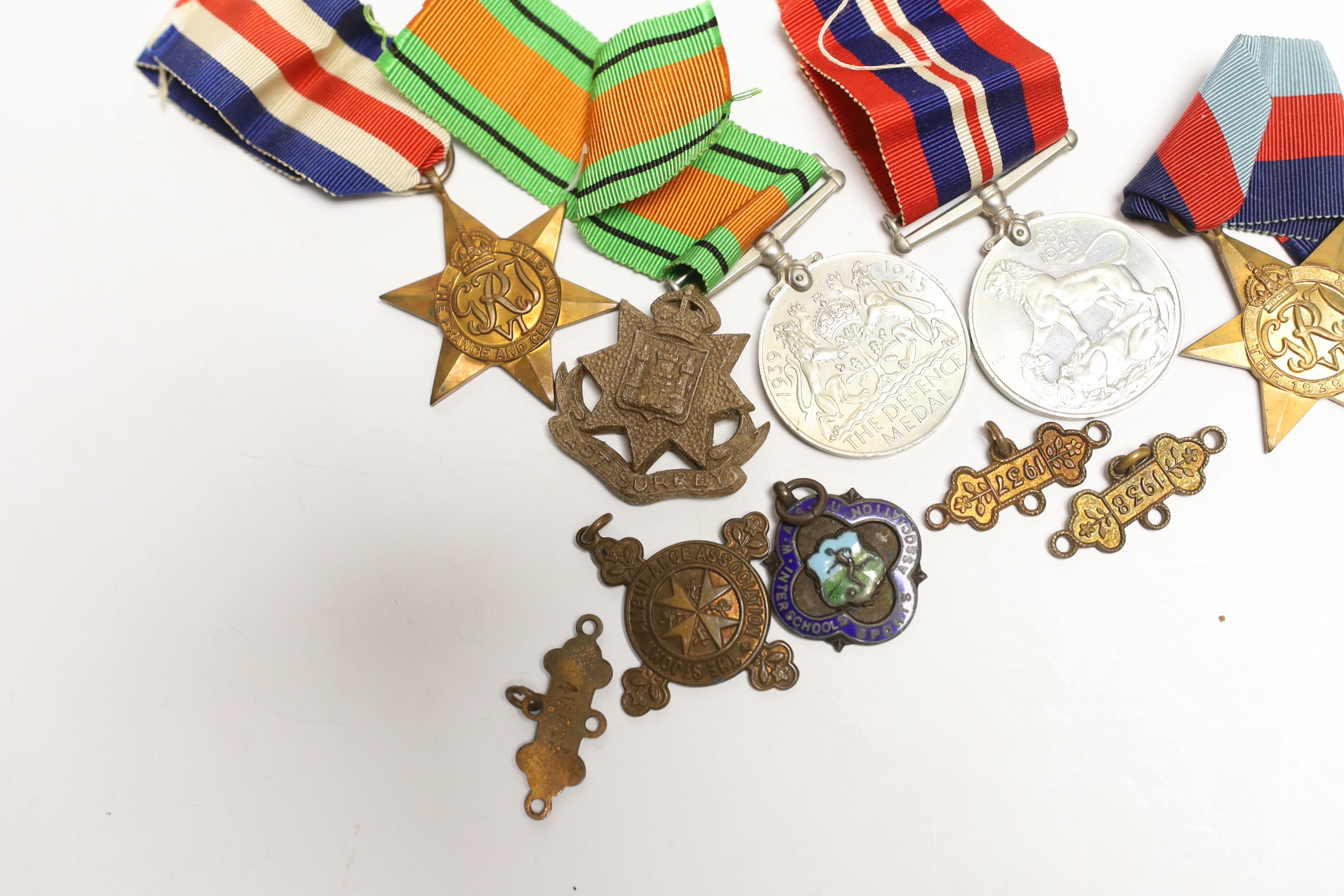 Four WW2 medals- the Defence Medal, the War medal, the 1939-1945 Star and the France & Germany Star and other minor items.